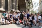 The 2018 Cuba trip cohort pose together with a statue in Havana. (Photo: Chris Tianyu Yao)
