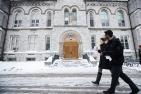Students walk past Theological Hall. (Photo by Lars Hagberg)