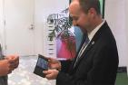 "Mayor Bryan Paterson tries out the ReFlex bendable smartphone"