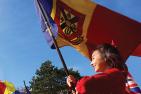 Student waving Queen's flag.