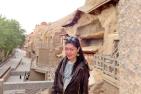 [Emily Gong on site at Mogao grottoes]