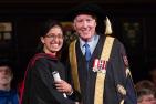 [Chancellor Jim Leech congratulates a Queen's graduate]
