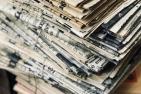 [A stack of old newspapers]