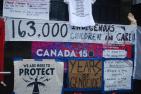 Posters protesting Canada’s sesquicentennial celebrations in Toronto on July 31, 2017. (Shutterstock)