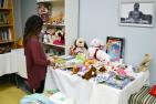 The daughter of a Queen’s student picks out donated presents for the holiday season, during the Winter Bazaar at the Ban Righ Centre. (University Communications)