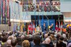 Streamers unfurl above the audience at the official opening ceremony for Mitchell Hall.