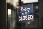 [Photo of a "Sorry We're Closed" sign by Tim Mossholder for Unsplash]