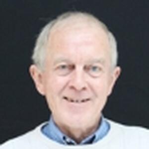 [Photo of Dr. J. Harry McCaughey}