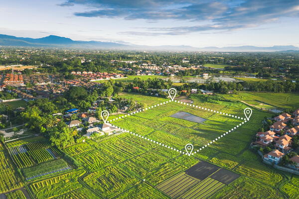 Aerial view of a field with map markers on it.