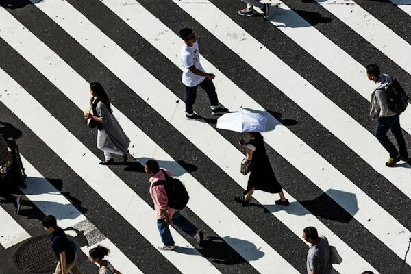 People walking on striped road