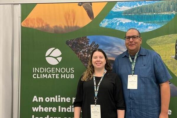 Shyra and Ryan Barberstock with their booth at Adaptation Futures 2023.