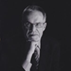 [Photo of Dr. Rowland Tinline]