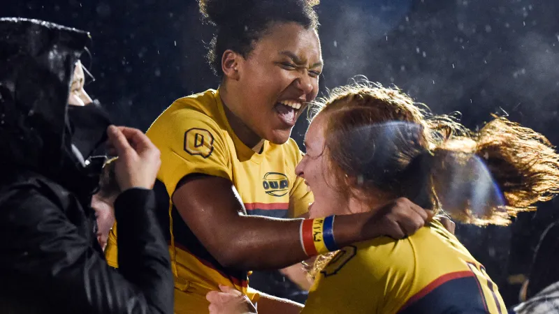 Photo of a group of women with the Gaels jersey celebrating