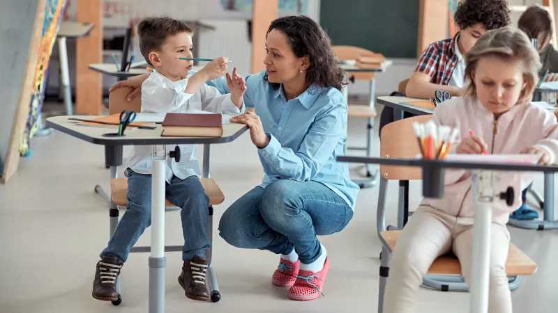 Classroom with professor and children.