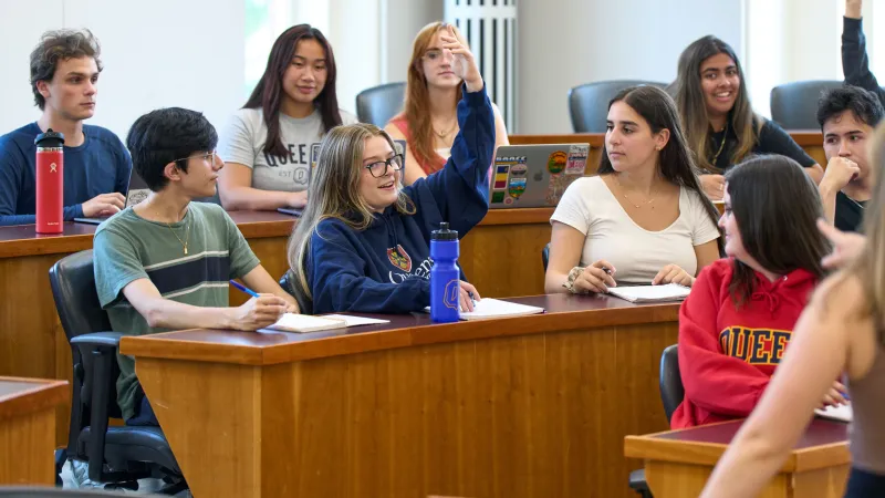 Group of students participating in a class, all seated and being part of the conversation.