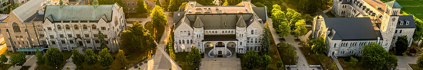 Aerial view of Queen's campus with stone academic buildings,