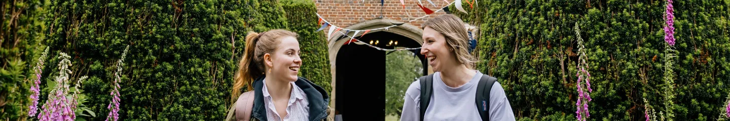Two students are walking and chatting