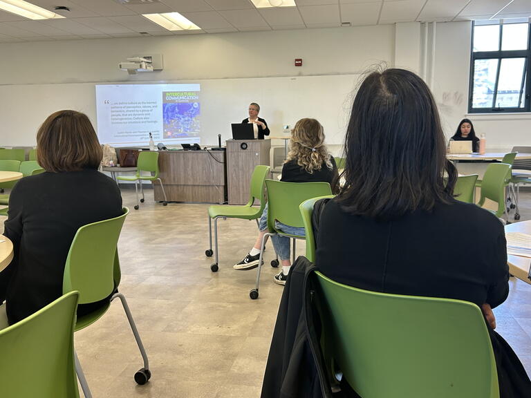 A woman presents in a classroom