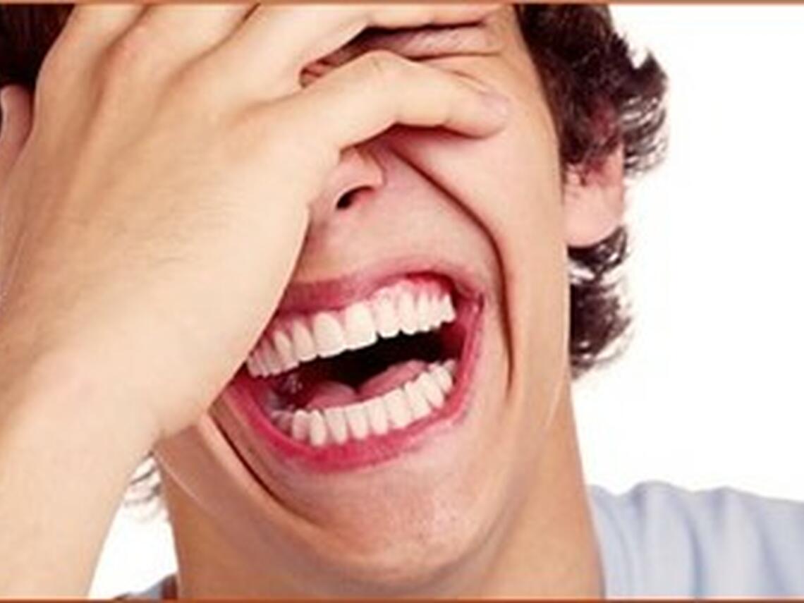 Photo of a man laughing