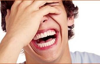 Photo of a man laughing