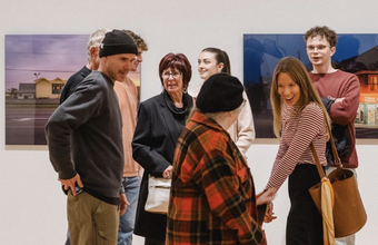 Photo of people at the Agnes Etherington Art Centre, gathered for the Exhibition Celebration