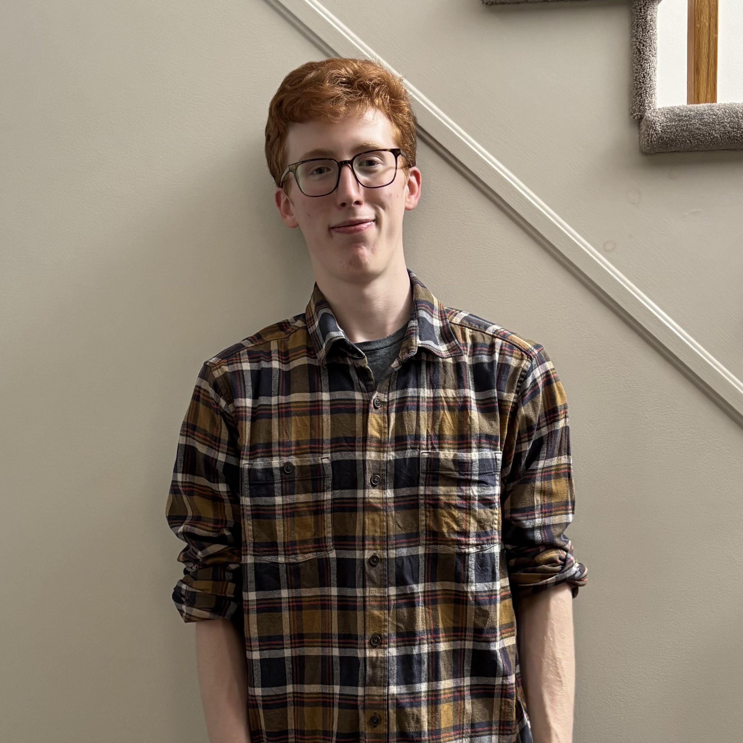 A photo of Jack wearing a plaid shirt