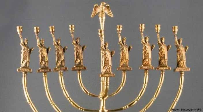 An image of a Menorah with the statue of liberty at the top of each candlestick