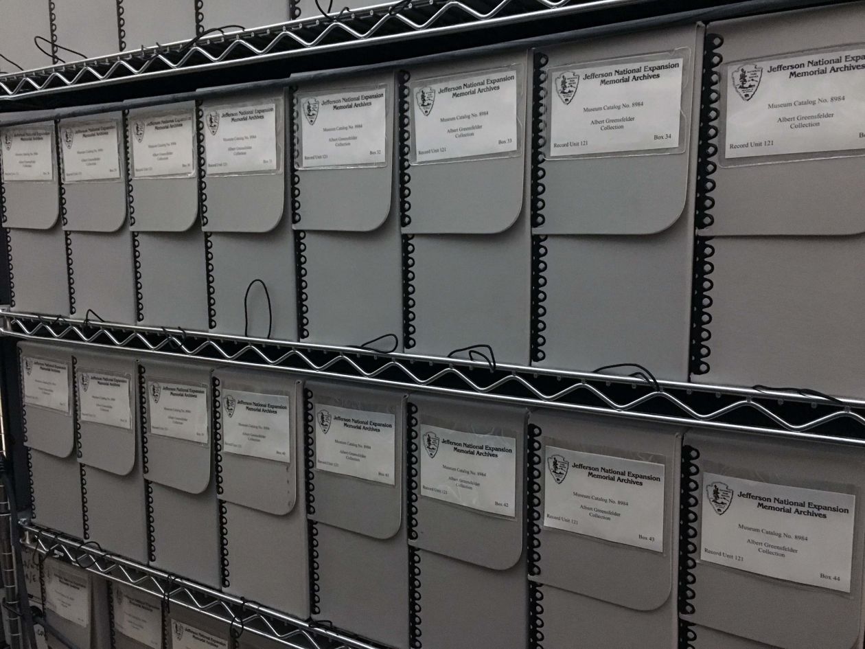Image of a shelf full of archival storage boxes