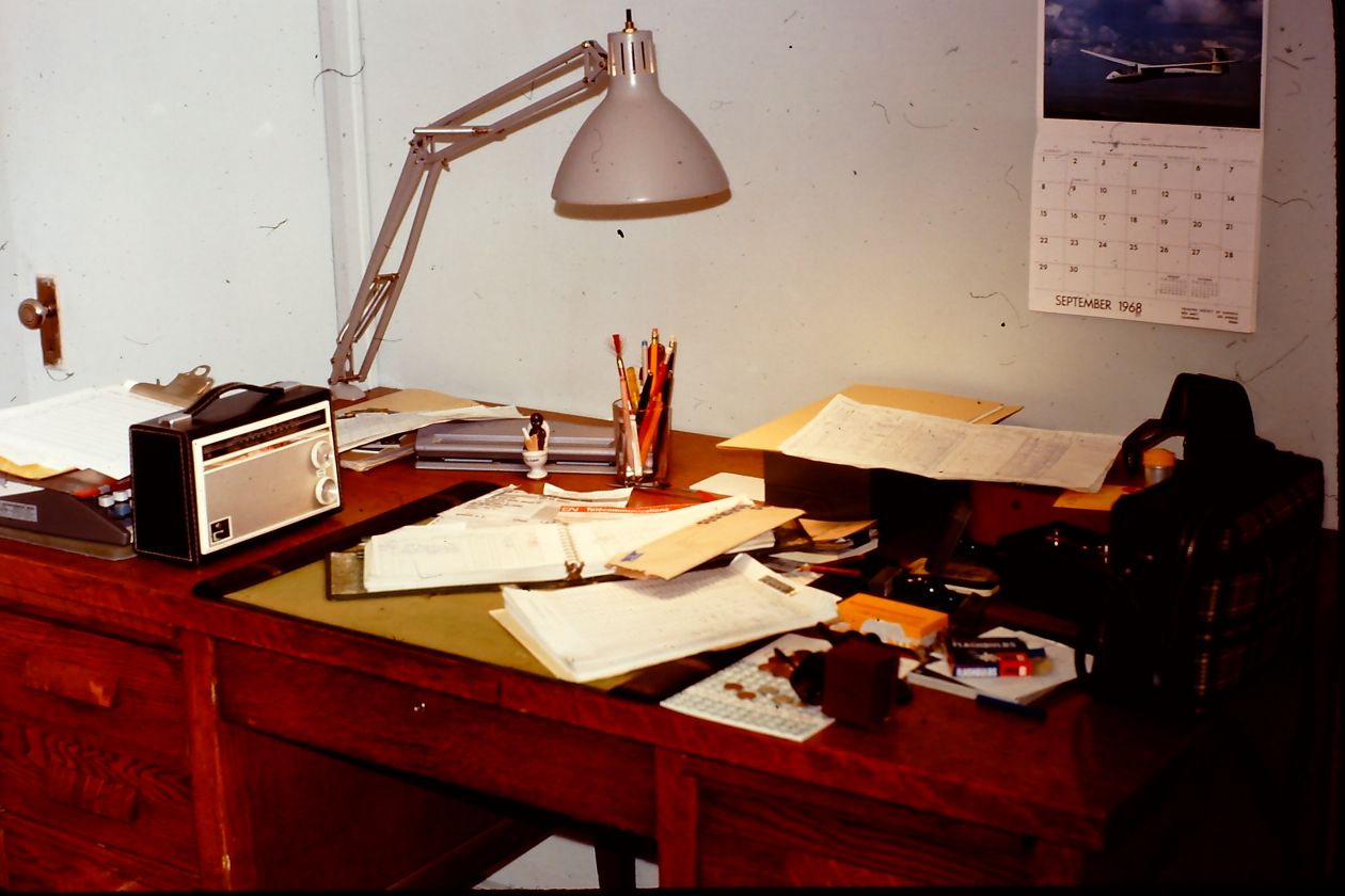 An image of a desk covered in various papers