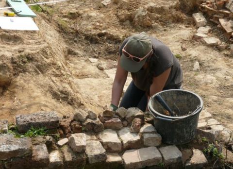 A student working at an archaeological site. 