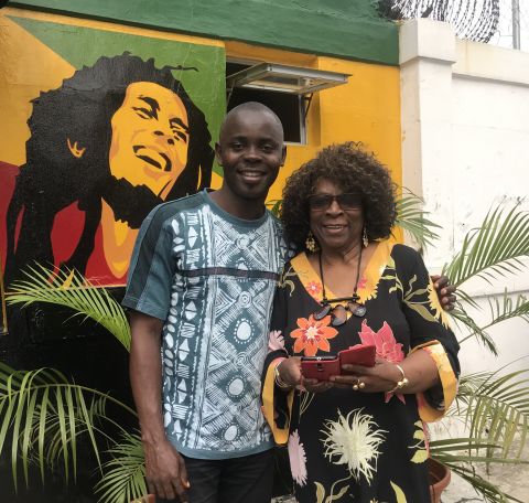 Image of Speaker with a young man mentioned in the talk