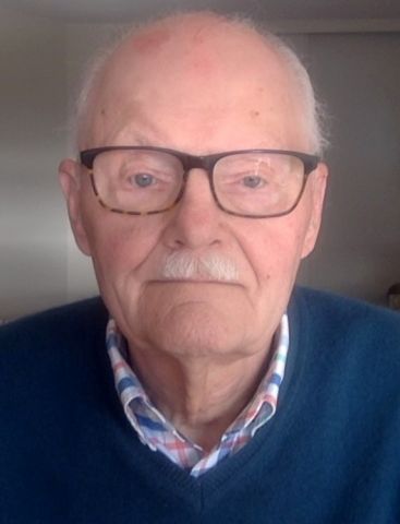 An image of Paul Christianson wearing a blue sweater