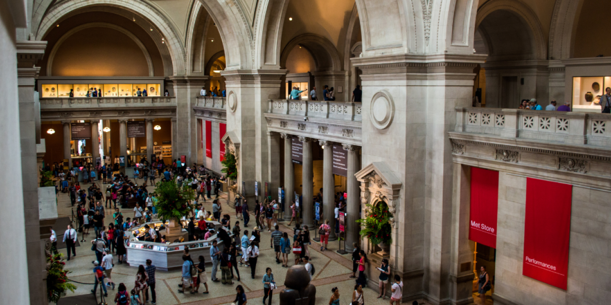 An image of the Met Museum filled with people