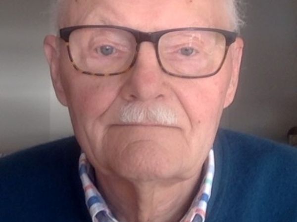 An image of Paul Christianson wearing a blue sweater