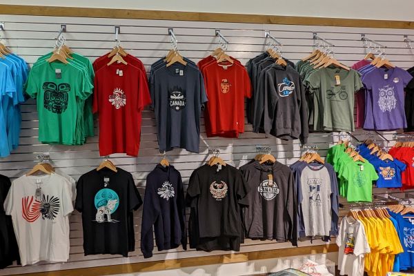 Rows of t-shirts with Canadian symbols on sale at a gift shop
