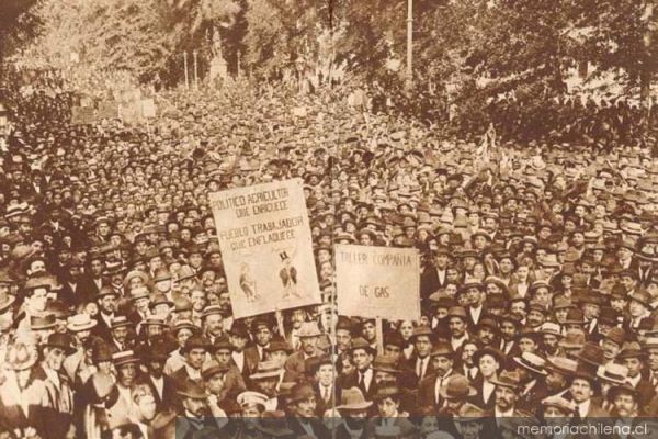 A sepia-toned image of many men protesting crowded together wearing hats