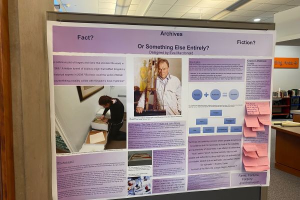 A photo of Eva McDonald's poster board on her HIST 212 internship with the Kingston & Area Museums, Art Galleries, and Historic Sites, featuring a purple poster board with a title that reads Archives: Fact? Fiction? Or Something else entirely?