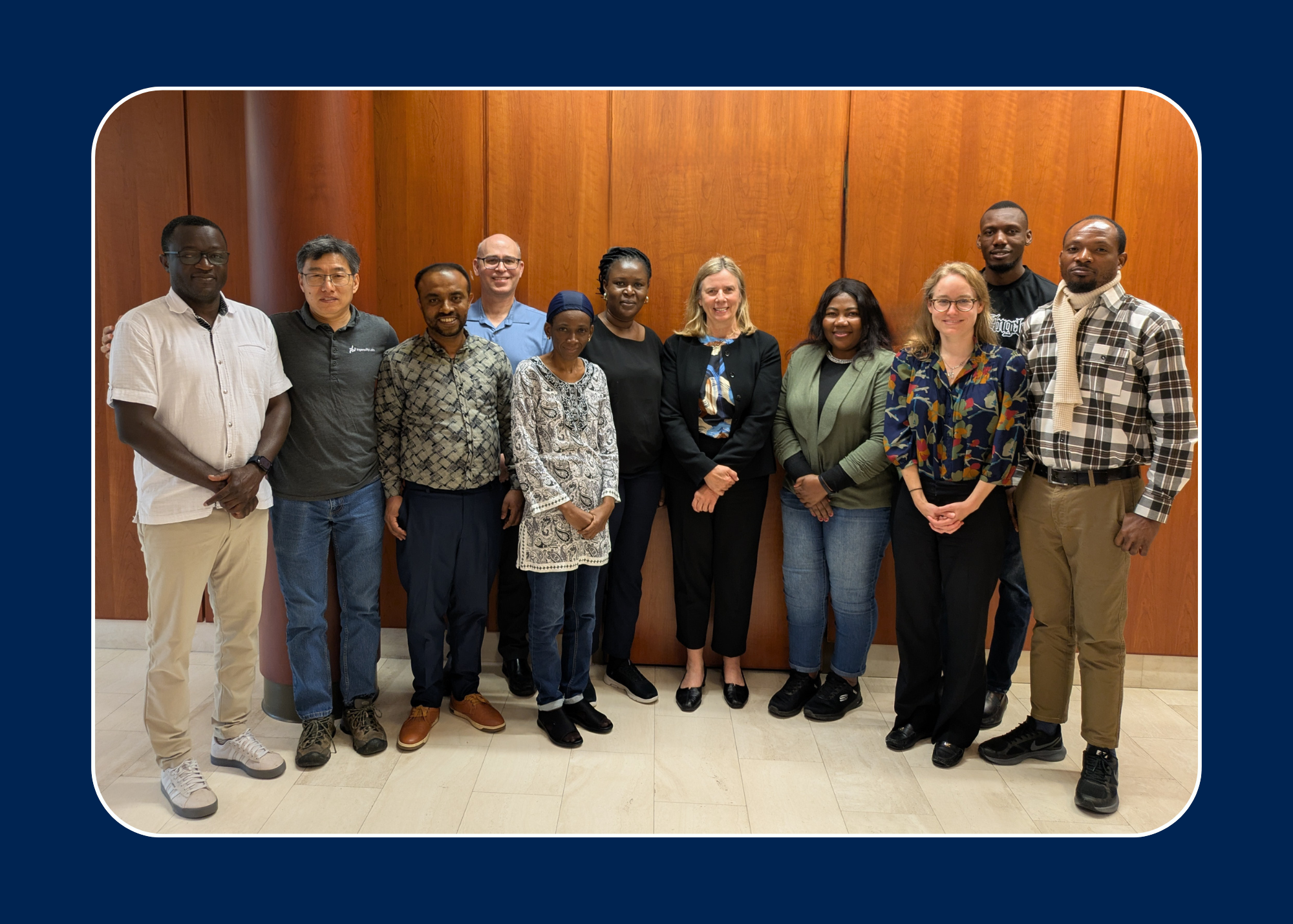 11 Individuals smiling in Richardson Hall