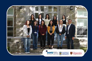 Jeremy Stewart standing with his research team in front of a limestone building