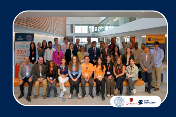 Participants at the IDEAS 2026 International Symposium pose for a group photo at Queen’s University.