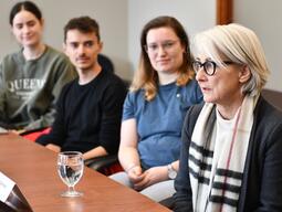 Her Excellency Sabine Sparwasser, three students