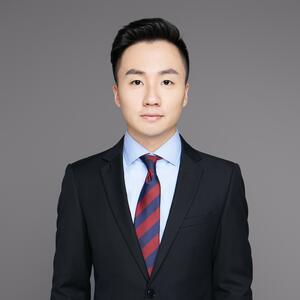 [Hyman Haoyong Xu in a suit looking forward]