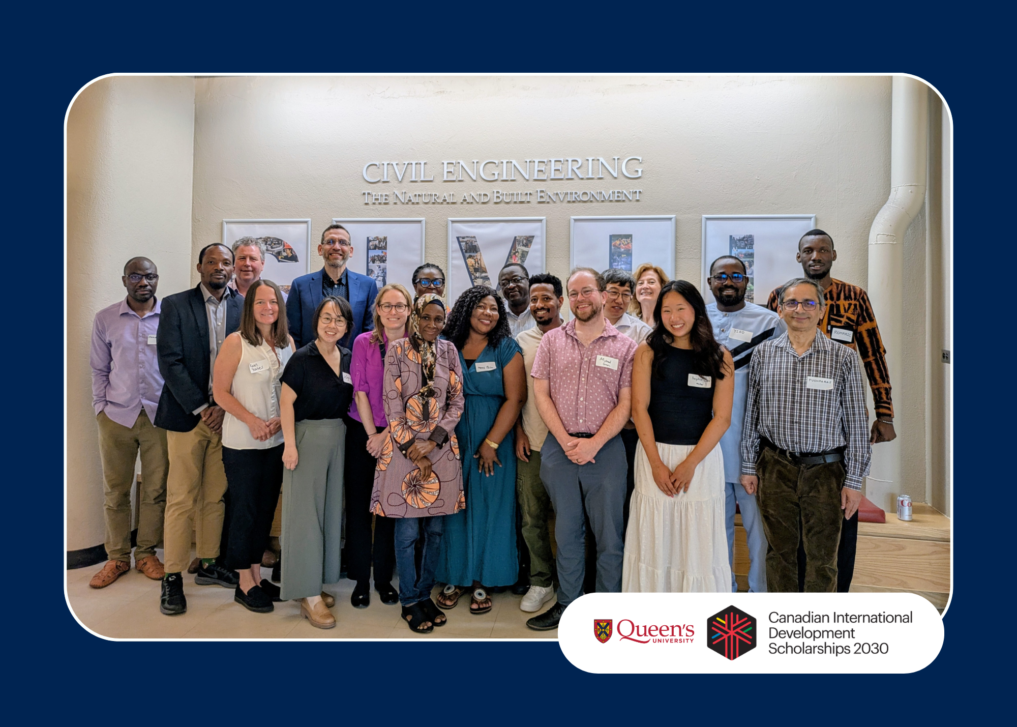 Group of people posing in front of a "Civil Engineering" sign at Queen's University for the Canadian International Development Scholarships 2030.