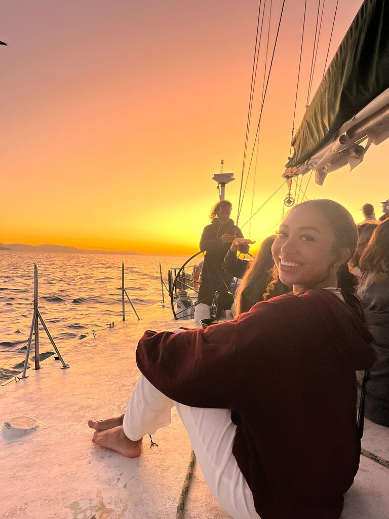 Elena on a boat at sunset