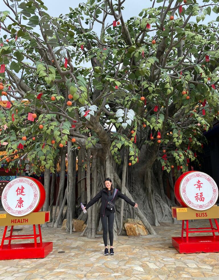 Amanda standing in front of a tree