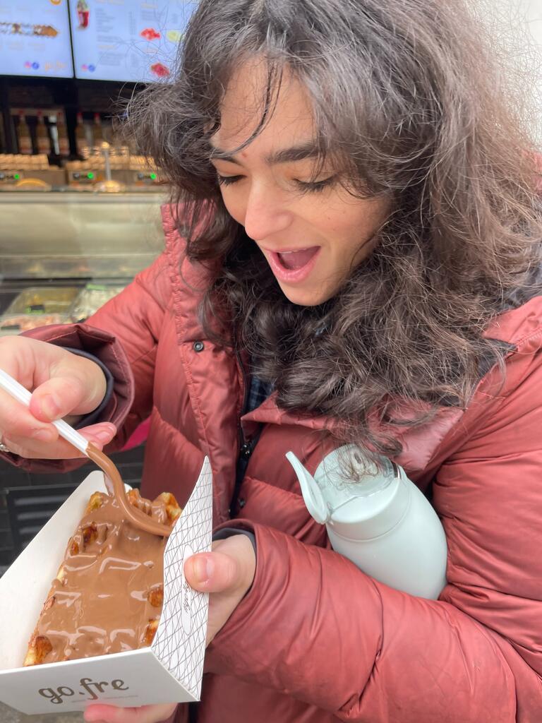 Abby is eating a waffle