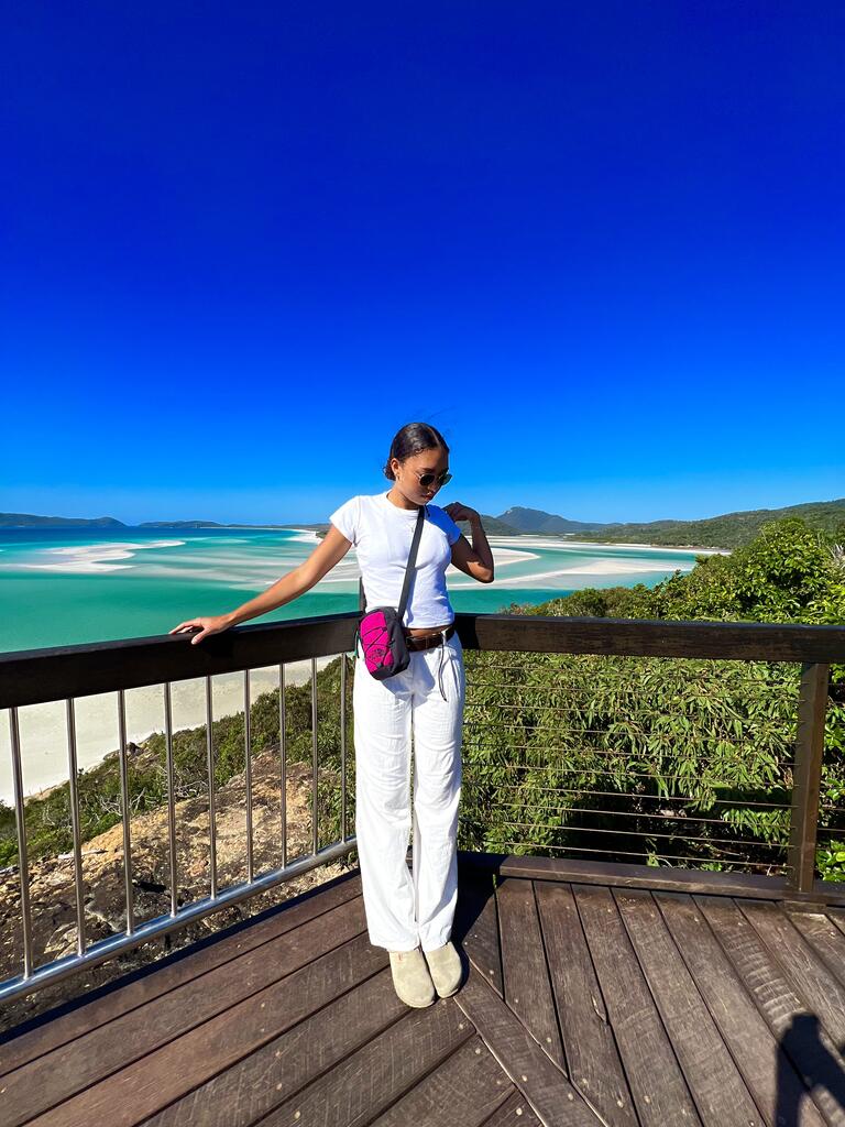 Elena in front of the turquoise water and bright blue sky