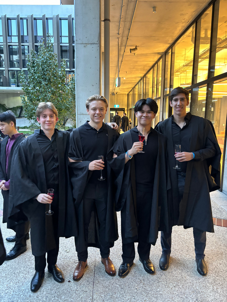 Jack and friends in long black overcoats