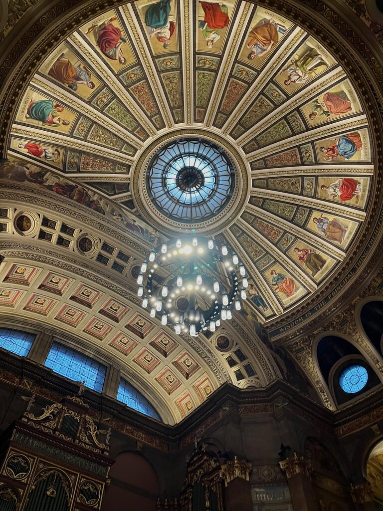 An ornate ceiling of paintings