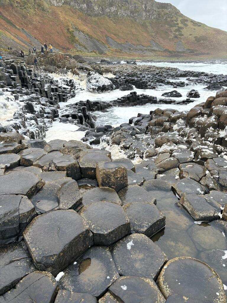 old stones in front of water